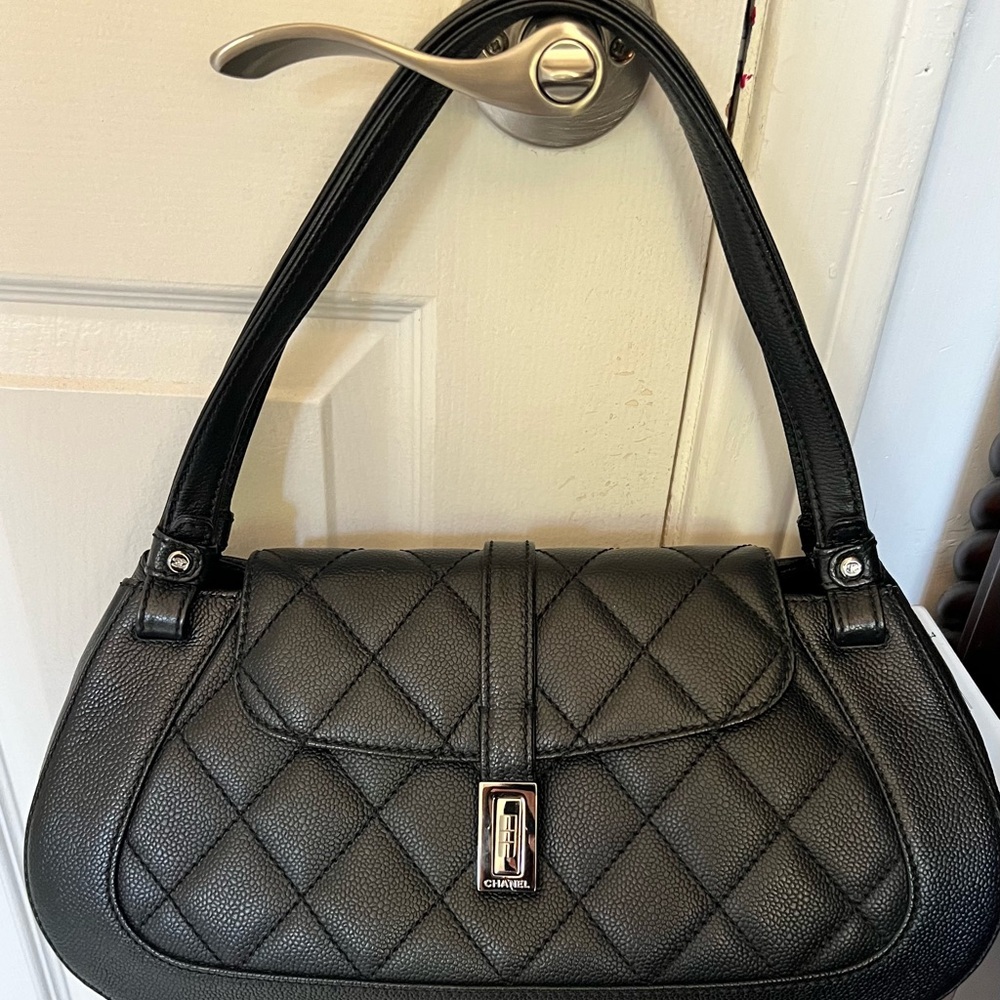 Chanel bag black caviar leather with flap.